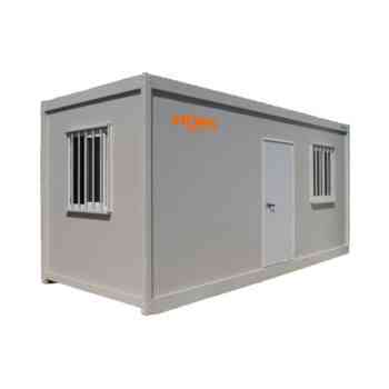 Grey portable container building with a door and two barred windows; HOMS Rentals logo on the side (used as a small office or storage unit)